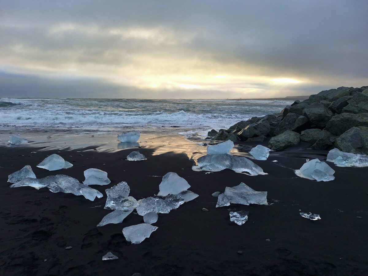 ice on diamond beach at sunset in iceland